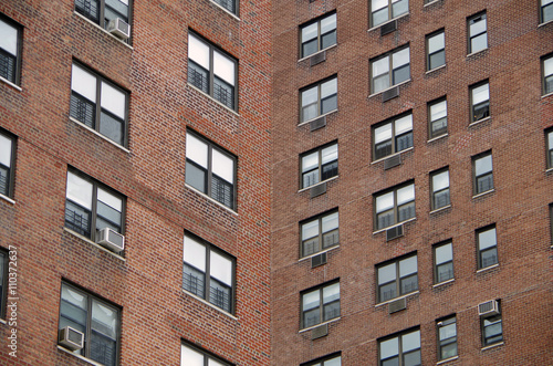 Looking up at a detail view of a nyc apartment buildings intersecting perspective