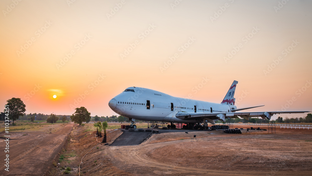 Airplane wait for maintenance at sunrise in outdoor Airplane wait for maintenance at sunrise in outdoor