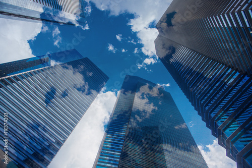 Sky and clouds reflection in skyscrappers photo