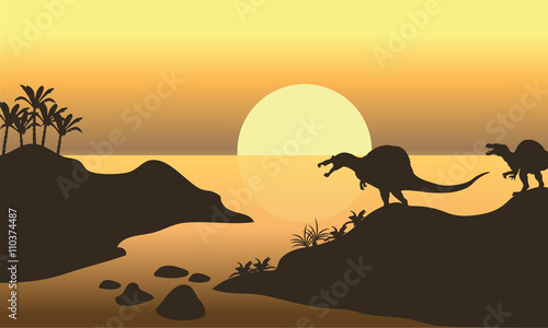 Silhouette of spinosaurus in riverbank