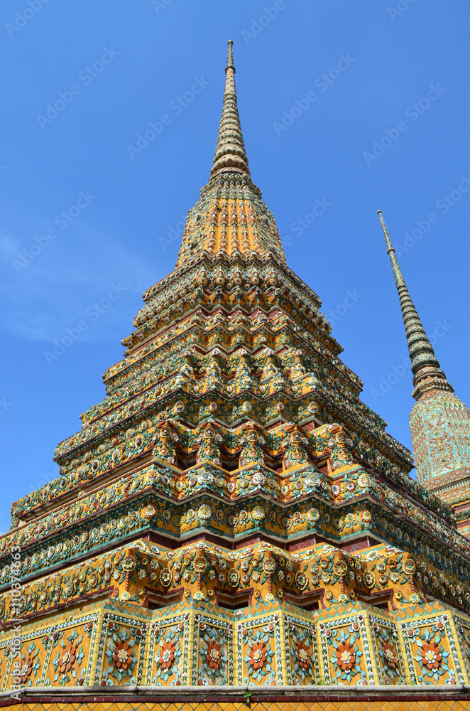 Thai pagoda with blue sky background, Wat Pho, Bangkok, Thailand