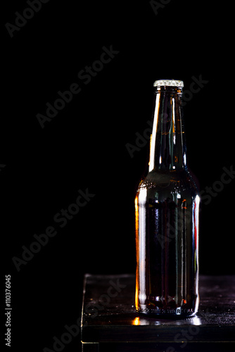 Bottles of beer on black  background
