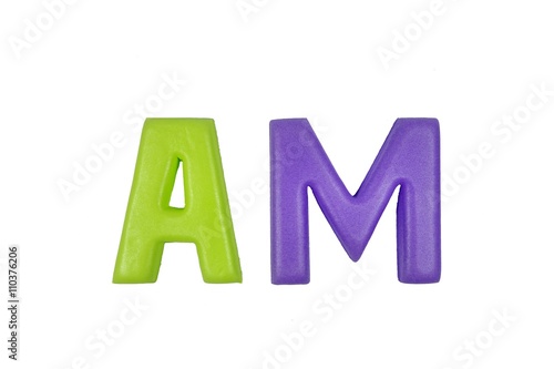 Colorful foam letters spelling AM on white background