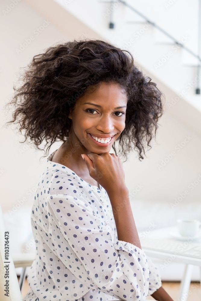 Happy businesswoman with hand on chin Happy businesswoman with hand on chin