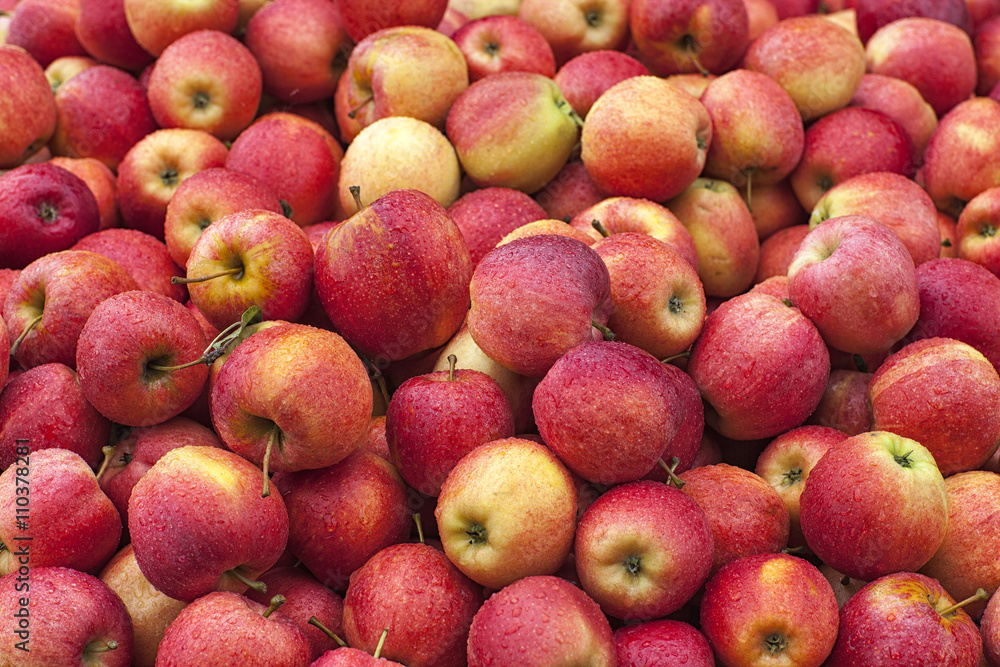 a stack of red apples