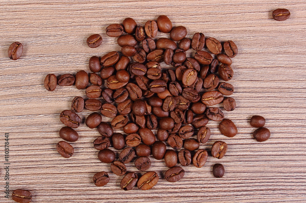 Heap of coffee on wooden background Heap of coffee on wooden background