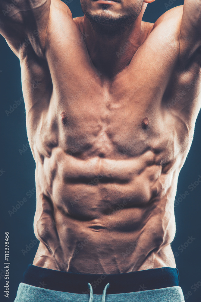 Strong Athletic Man Fitness Model Torso showing six pack abs. is Strong Athletic Man Fitness Model Torso showing six pack abs. is