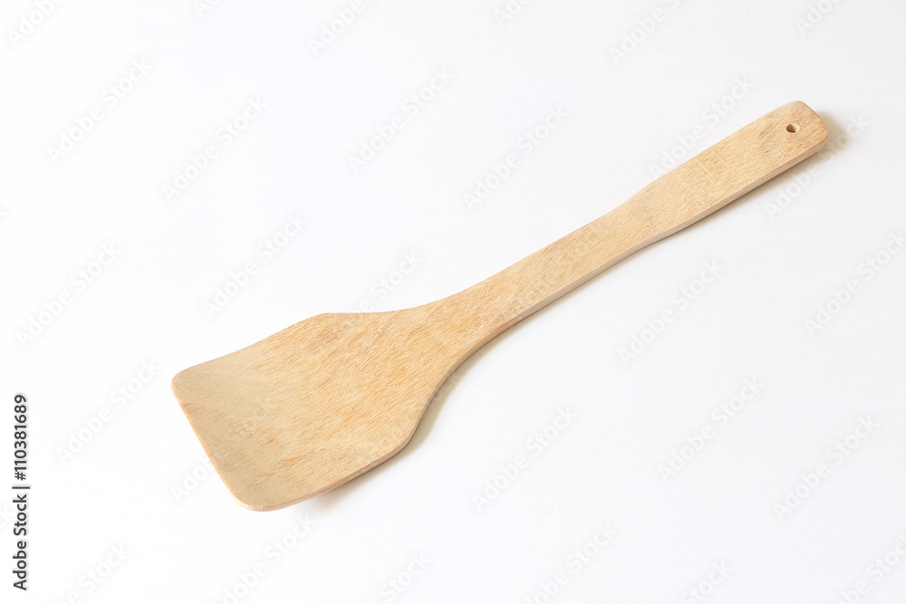 Wooden Spatula on wooden on white isolated background Wooden Spatula on wooden on white isolated background