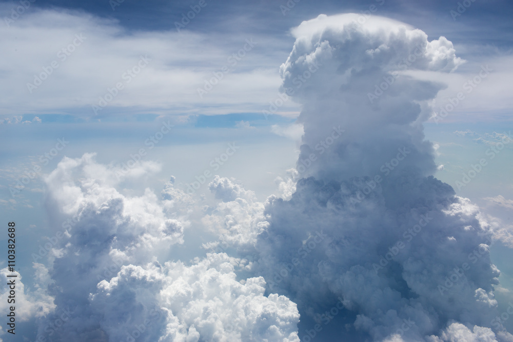Fototapeta premium Above the clouds.Aerial cloudscape sky in stratosphere shot from airplane window