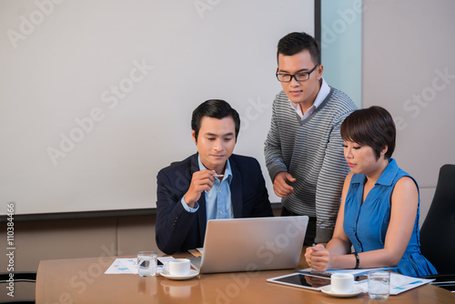 Vietnamese business team working on project together