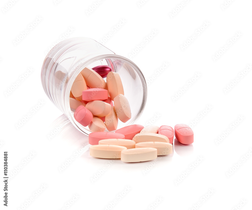 Pill glass spilling pills on white background. Pill glass spilling pills on white background.