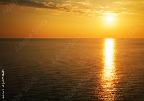 Beautiful sunset over the ocean. Sunrise in the sea © es0lex