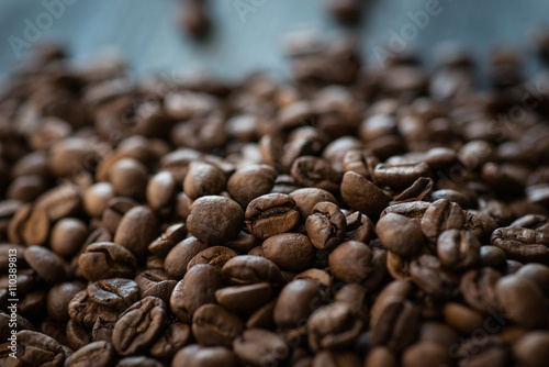 Roasted coffee beans on old wooden table