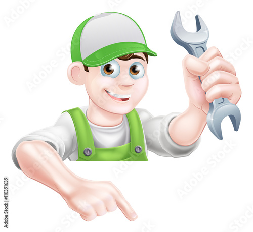 Man Holding Spanner and Pointing