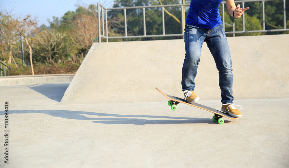 skateboarding woman practice ollie at skatepark skateboarding woman practice ollie at skatepark