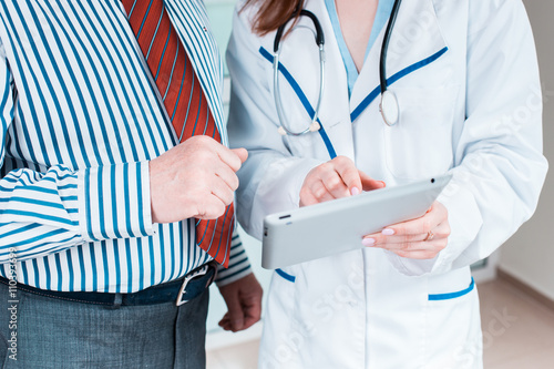 Close-up of doctor and patient hands photo