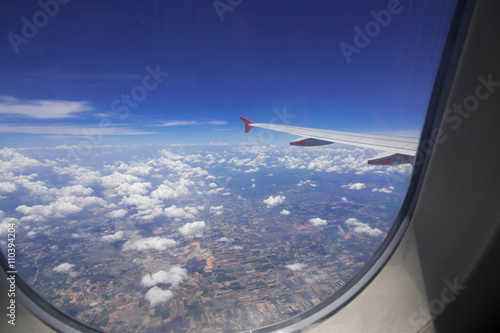 Looking through window aircraft during flight in wing with top view 