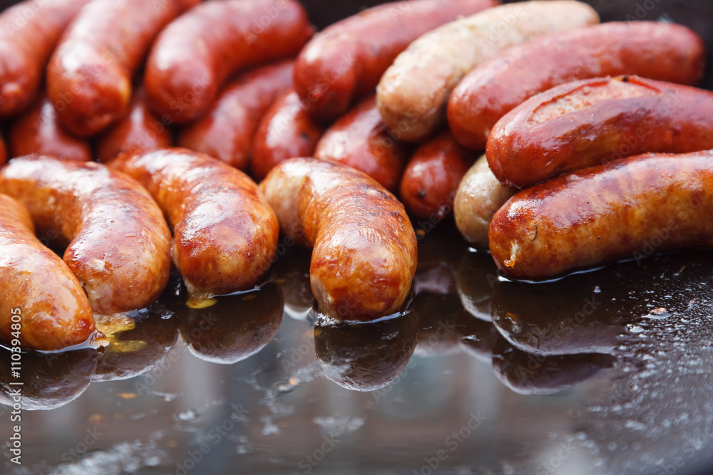 Street food. Sausages fried Street food. Sausages fried