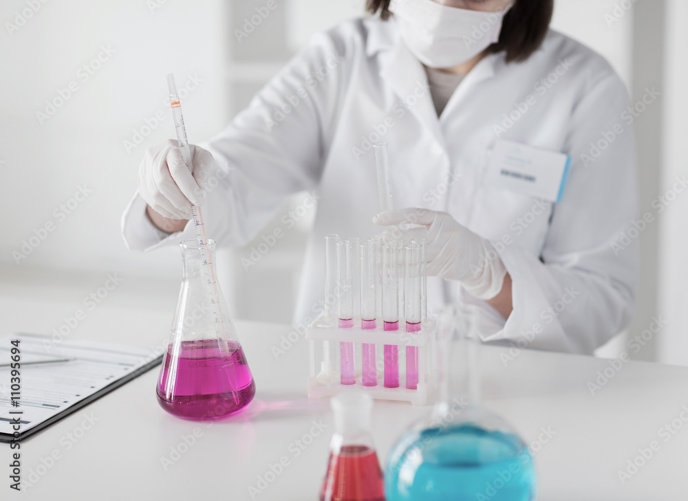 close up of scientist making test in lab close up of scientist making test in lab