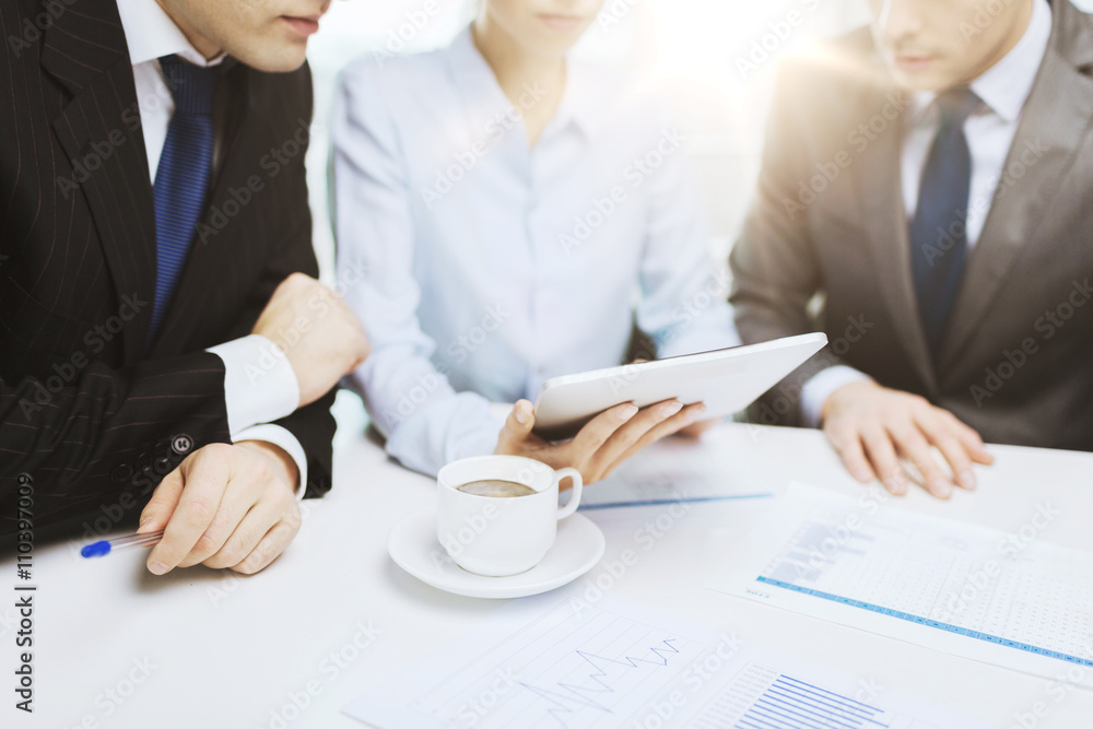 business team with graph, tablet pc and coffee business team with graph, tablet pc and coffee