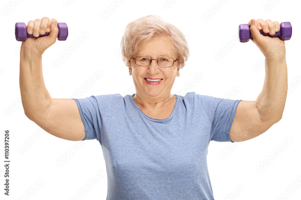 Mature woman exercising with dumbbells Mature woman exercising with dumbbells