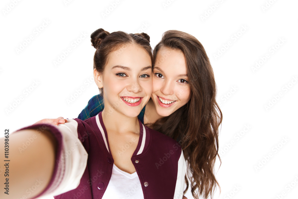 happy smiling pretty teenage girls taking selfie