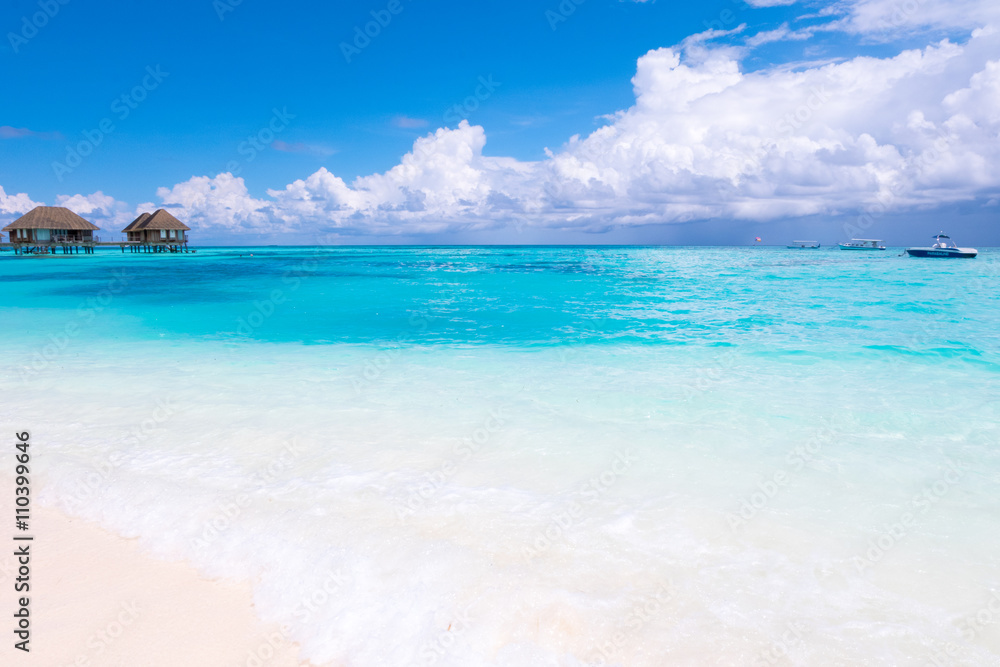 Beach in Maldives with blue sky background.