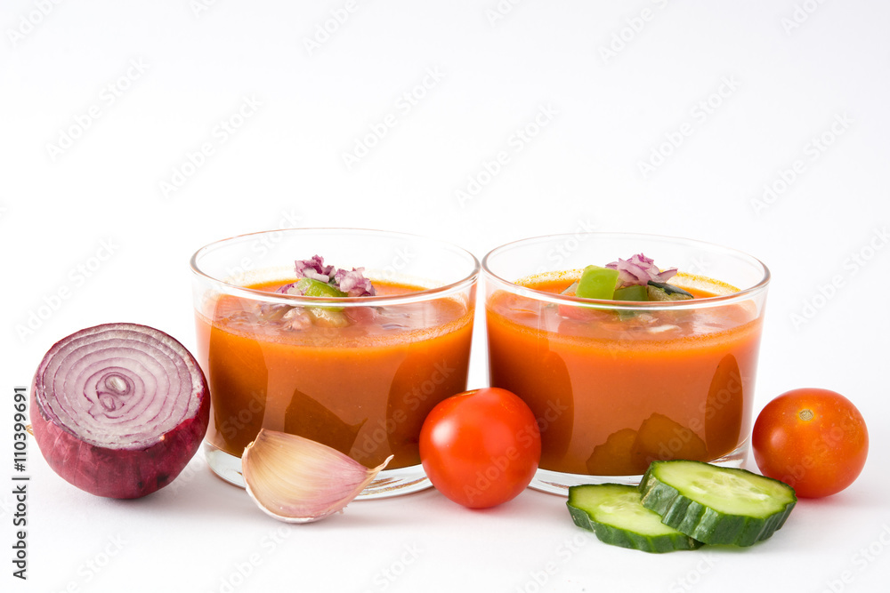 Gazpacho soup in glass and vegetables isolated on white background
Gazpacho soup in glass and vegetables isolated on white background