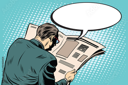 Businessman reading a newspaper