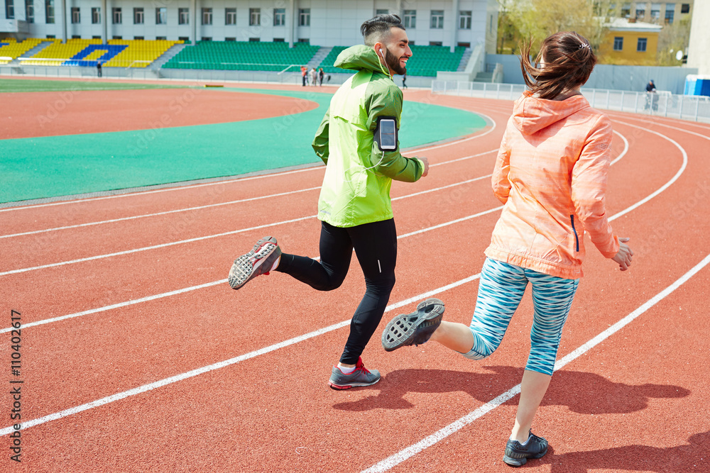 Fototapeta premium Young couple running