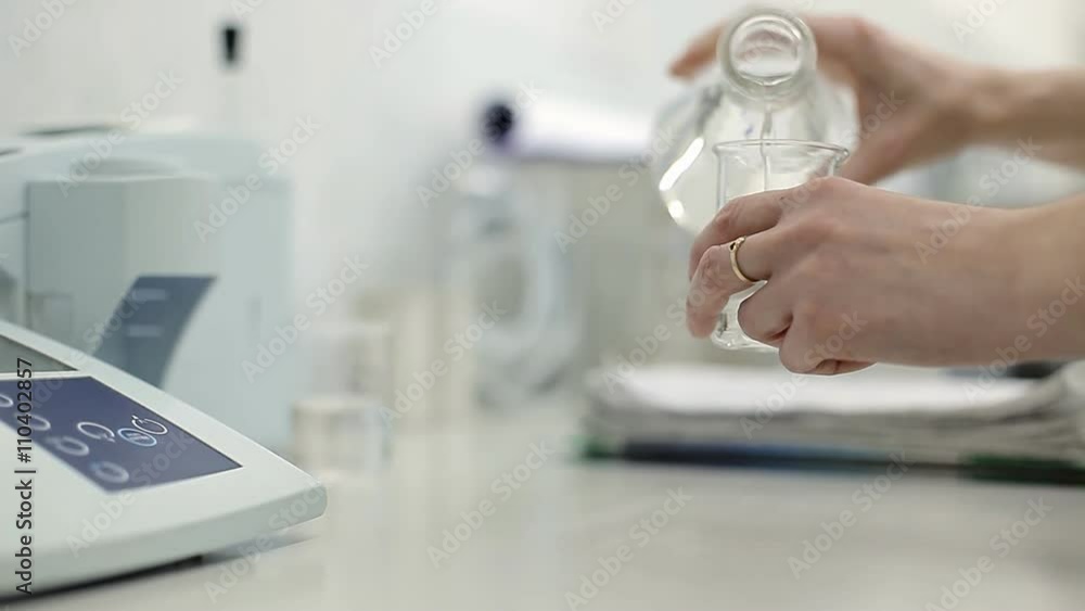 A technician is checking the quality of water A technician is checking the quality of water