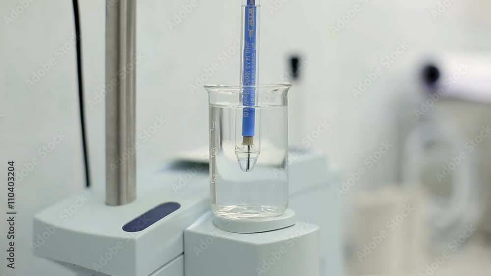 A technician is checking the quality of water A technician is checking the quality of water