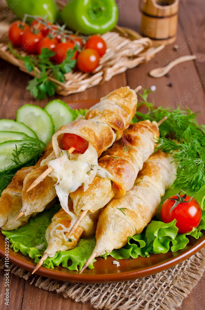 Kebab with tomatoes and cheese in pastry Kebab with tomatoes and cheese in pastry