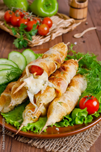 Kebab with tomatoes and cheese in pastry
