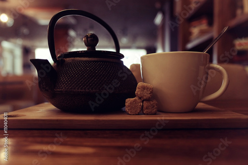 teapot and cup of tea at a cafe