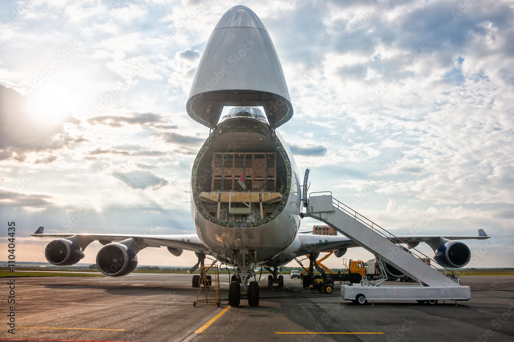 Unloading widebody cargo airplane - obrazy, fototapety, plakaty 
