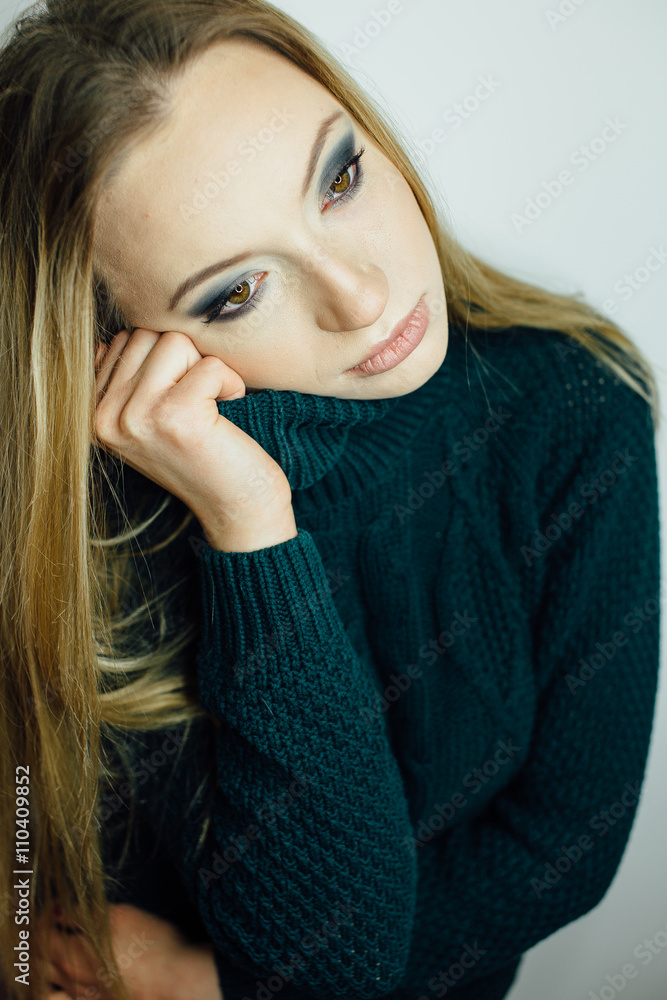 Young woman standing on the white background Young woman standing on the white background