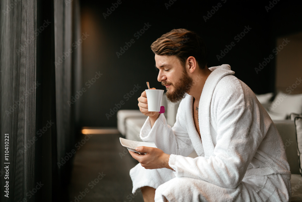 Male relaxing while drinking tea Male relaxing while drinking tea
