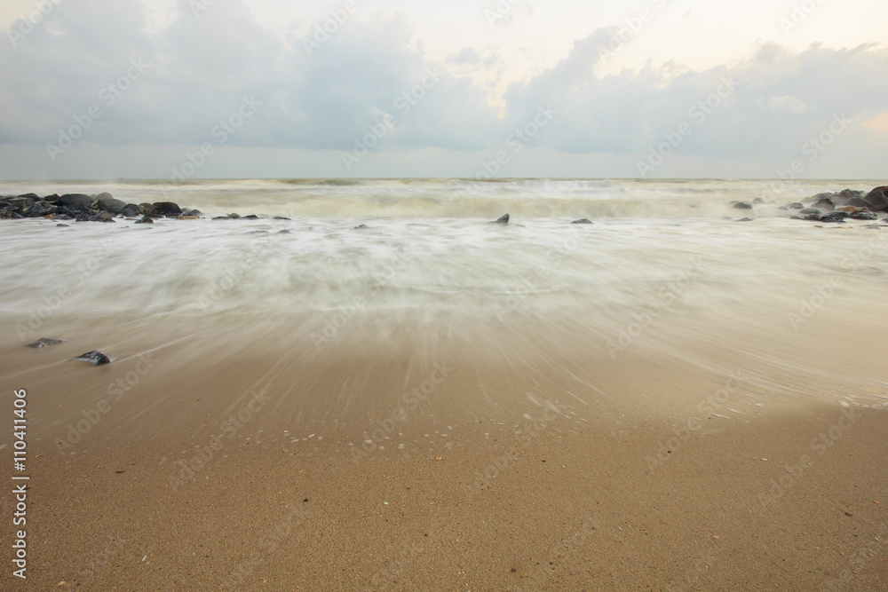 landscape of sea which have breakwater and cloudy sky on windy day ; Songkhla Thailand (slow shutter speeds)