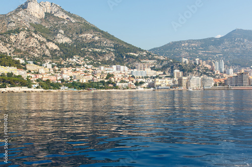 Luxury apartment buildings and condominium residences on the rocky, mountainous Mediterranean coast of the French Riviera. Horizontal with copy space for text