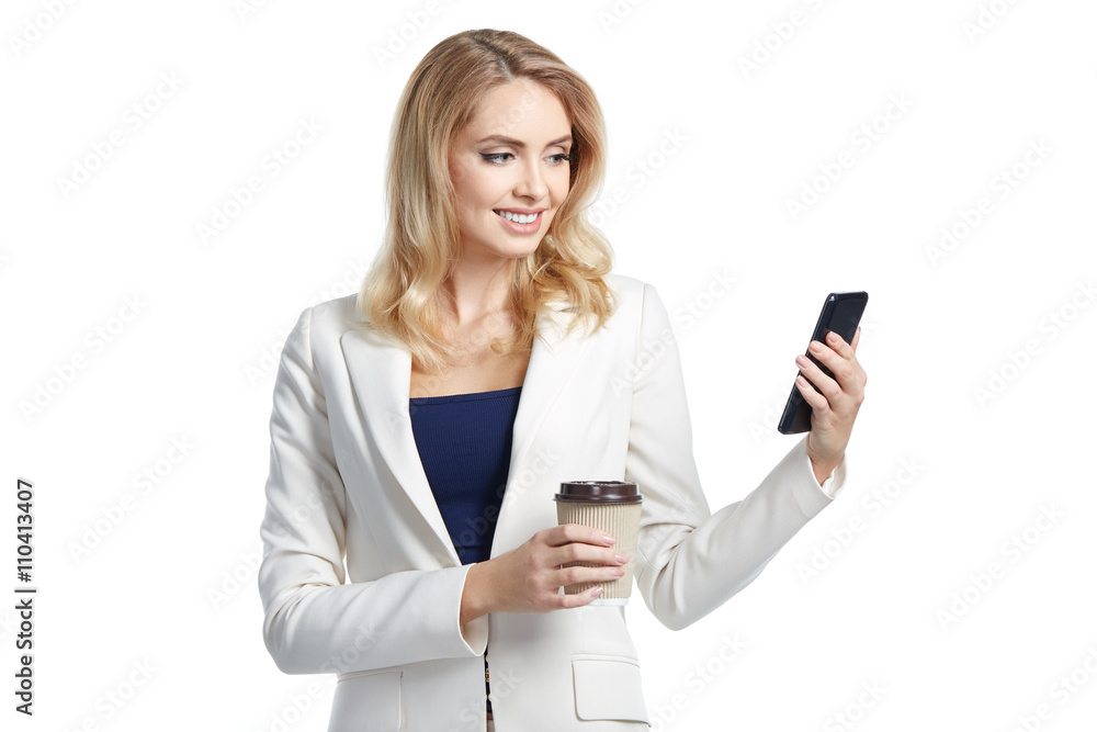 Beautiful business woman holding paper glass of coffee and phone Beautiful business woman holding paper glass of coffee and phone