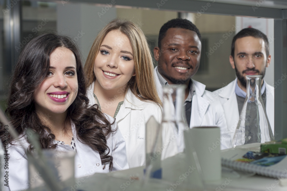 Group of young medical workers are working in lab as lab technic Group of young medical workers are working in lab as lab technic