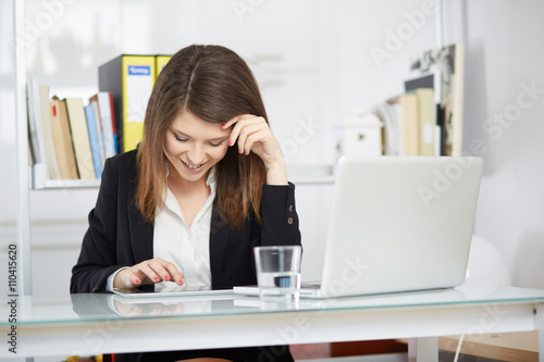 young businesswoman working in her office