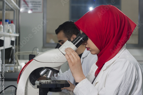 Group of young medical workers are working in lab as lab technic