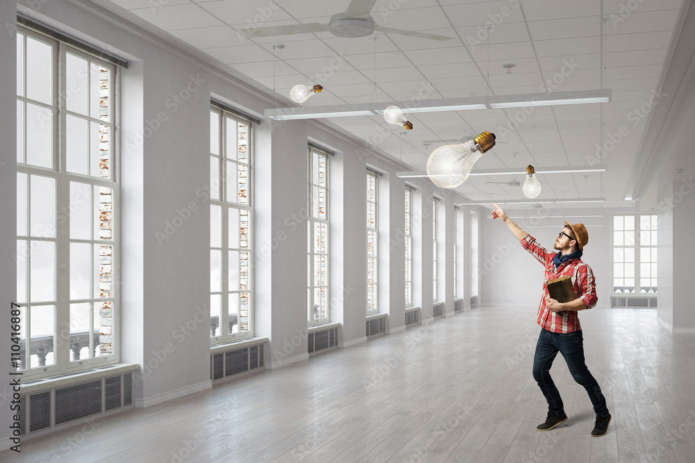 Fototapeta premium Hipster guy with book in hands