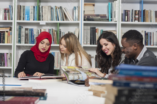 Group of students studying at university library