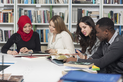 Group of students studying at university library