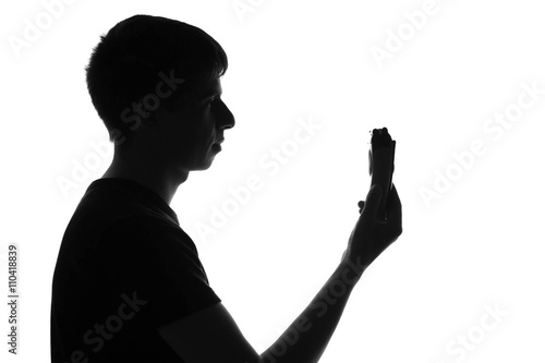 silhouette of an electric shaver in hand man