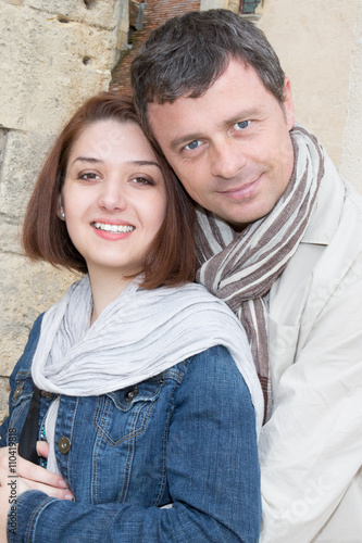 Cheerful couple looking at camera outdoors © OceanProd