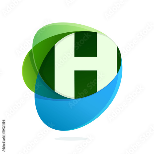 H letter with green leaves and blue drops.